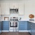 kitchen with blue and white cupboards and white counters